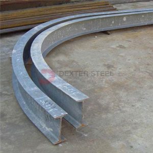 Side view of a long steel beam with a slight vertical curve
