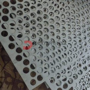 Turret punch press rapidly punching holes in a steel sheet