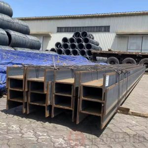Carbon steel I-beams stacked horizontally, structural framing material