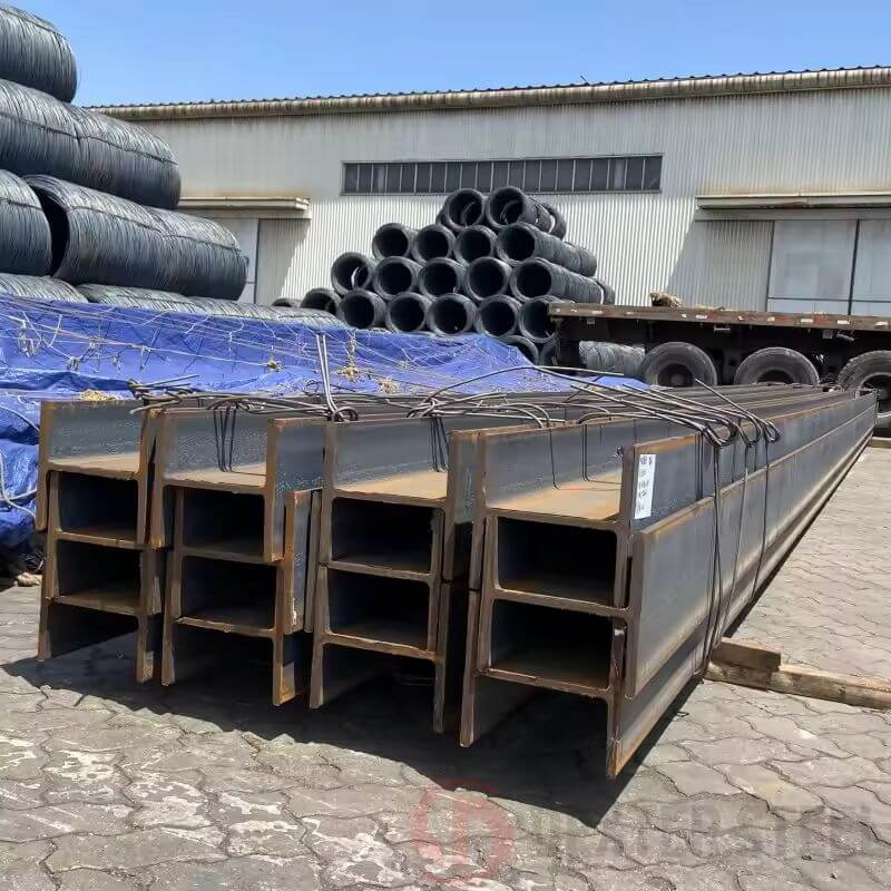 Carbon steel I-beams stacked horizontally, structural framing material
